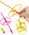 Hand launching 50 Pack Flying Disc Toy Set With Swirly Sticks, Spinners, And Rings, Colorful Outdoor Launchers For Kids.