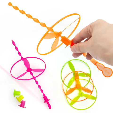 Hand launching 50 Pack Flying Disc Toy Set With Swirly Sticks, Spinners, And Rings, Colorful Outdoor Launchers For Kids.