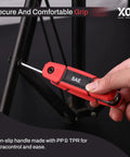 Person using 17 Piece Folding Allen Wrench Set With SAE And Hex Keys for tightening screw on black metal furniture.