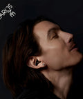 Man wearing Dope High Fidelity Reusable Musicians Ear Plugs For Festivals And Live Shows with noise reduction and clear sound.