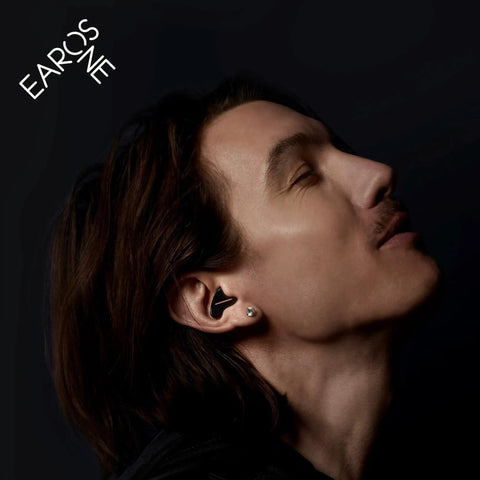 Man wearing Dope High Fidelity Reusable Musicians Ear Plugs For Festivals And Live Shows with noise reduction and clear sound.