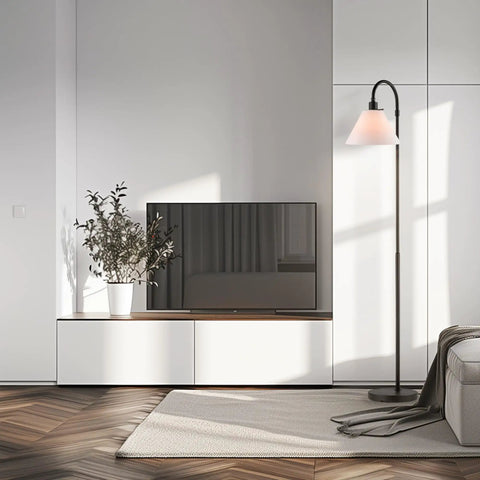 Barden 58 Inch Floor Lamp in dark bronze with beige fabric shade placed in modern living room next to a media console