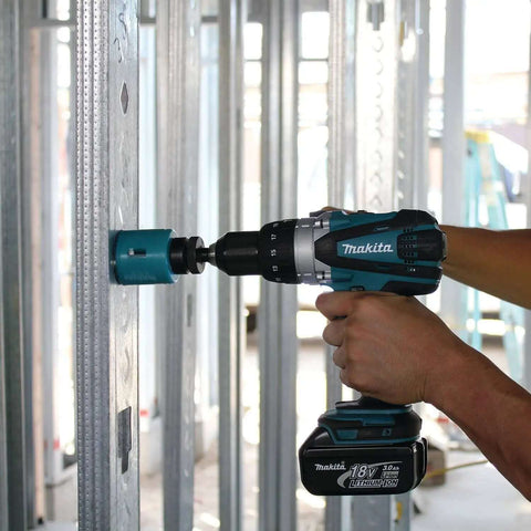 Rock Solid Eighteen Volt Cordless Hammer Driver Drill Kit Featuring Killer Torque Two Speed Gears and Hella Durable Ergonomic Build in use.
