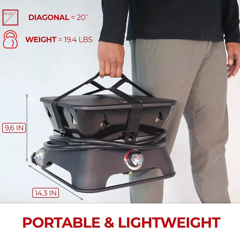 Man carrying Firecube 14 Inch Portable Smokeless Propane Fire Pit With Carry Kit And Lava Rocks, 58,000 BTU, Black