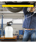 Top Tier SucceBuy 10L Transmission Fluid Pump For Quick ATF Drain And Fill With Two Way Control Pressure Gauge Plus Fourteen Adapters For Cars And Trucks in use by a mechanic.