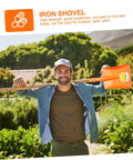 Heavy Duty Garden Shovel For Digging And Trenching displayed in garden with orange handle, held by a person smiling outdoors