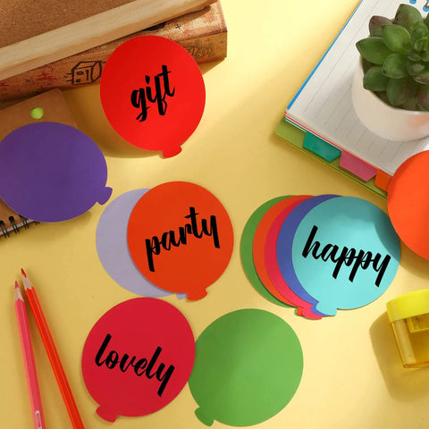 Colorful Balloon Cutouts For Classrooms And DIY Projects, 108 Assorted Hot Air Balloon Die-Cuts With 120 Glue Points on desk