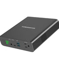27000mAh AC 130W Portable Laptop Charger With TSA Approval All In One On The Go Power Bank, black, with AC and USB ports.