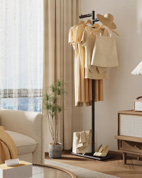 Freestanding Metal Coat Rack With Z Shaped Design, 175cm Tall Black Garment Tree On Heavy Rock Base in a modern living room