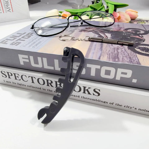 All In One Eyeglasses Repair Kit For Quick Adjustments And Tightening Frames With A Handy Screwdriver Includes Temple Bending Nose Pad Contouring And Replaces Multiple Tools At Home, shown with gray multifunction tool and black-rimmed glasses