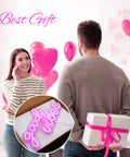 Man holding gift with Pink Good Vibes Neon Sign For Bedroom And Wall Decor, LED Neon Lights For Living Room Or Office inset