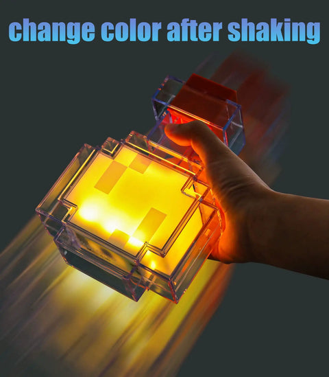 Person holding a yellow Color Changing Potion Bottle LED Table Lamp with shake feature, glowing in the dark