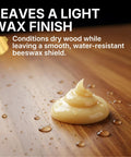 Native Bee Wax Wood Polish And Conditioner Blended With Bright Orange Oil Keep Your Furnishings Straight Up Pristine Restore Deep Color And Smooth Grain For A Clean Slick Shine 8 Oz on wooden surface with water droplets.