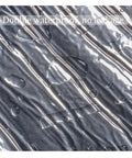 Close-up of Premium Synthetic Roof Underlayment Roll With Aluminum Foil Bitumen Tape showing waterproof surface with water droplets.
