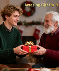 Young man giving a wrapped gift to an older man, both smiling, in a festive setting.