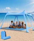 Grab And Go Beach Tent Sun Shelter 10x10 Ft UPF50 Plus Canopy with people enjoying shade on beach mat, sandbags visible