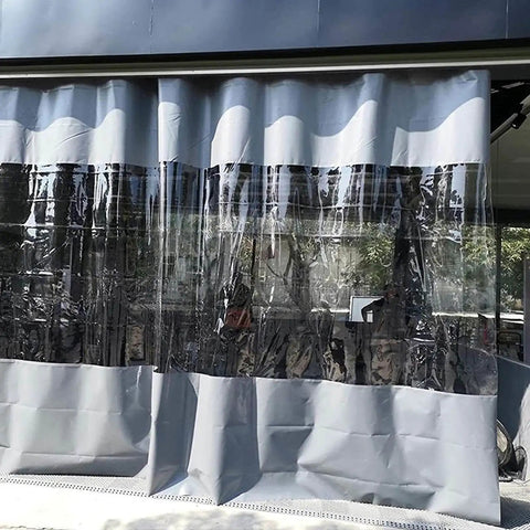 Kickass Clear PVC Tarp Curtains With A Seamless Zipper Door And Heavy Gauge Grommets Level Up Your Pergola Gazebo Or Patio Setup While Blocking Elements Like A Boss Year Round, shown hanging with a clear middle section.