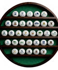 32 Ball Golf Display Case Wall Mounted Moon Shelf In Dark Brown Finish with 32 golf balls on green felt backdrop.