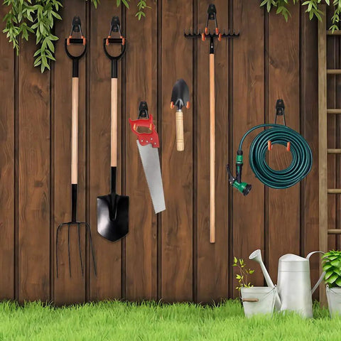 Garden tools organized with 12 Pack Heavy Duty Garage Wall Hooks With Extension Cord Straps against wooden paneling.