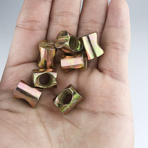 Hand holding 10 Pack Zinc Plated M8 Barrel Nuts 11.5mm Diameter 14.5mm Length For M8x1.25 Bolts Cross Dowels Slotted Nuts