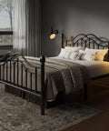 Queen Metal Bed Frame With Classical Headboard And Footboard Matte Black Steel Platform Bed Featuring Ornate Ball Details in a cozy bedroom.