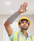 Heavy Duty Cut Resistant Wrist Sleeves Built Tough With Reinforced Denim For Industrial Steel Handling Abrasion Proof Forearm Guards That Kick Ass At Work Sites (1 Pair) worn by a worker looking up.