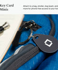 Key Fobs Four Pack NFC Enabled for Level Lock Plus Smart Locks Grey clipped to a blue bag, easy phone-free access on the go