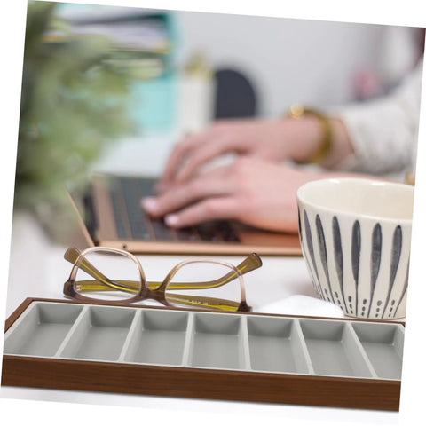 Premium Wooden Shade Keeper Tray Including Seven Gray Fabric Slots Top Tier Jewelry Glasses Watch Organizer on desk with glasses and cup.