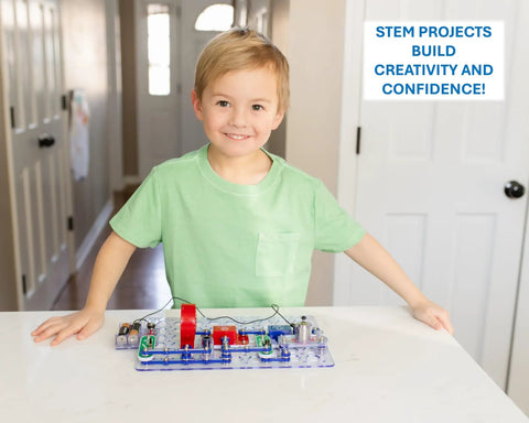 Child using Electronics Exploration Kit With 100 Plus Projects And Full Color Project Manual, 28 Part Set on a table