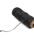Black spool from Waxed Leather Sewing Thread Kit With 55 Yard Spools And Pro Grade Needles, DIY Weave Repair For Upholstery, Car Interiors, Bags