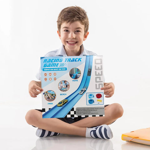 Boy holding Flexible Track Race Set For Kids With 15 Foot Modular Track, 4 Suction Cups, And Six Diecast Cars In 1 To 64 Scale.