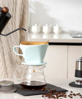 Travel Ready Ceramic Pour Over Coffee Dripper With Three Hole Flat Bottom Cone brewing coffee in kitchen, green and handmade