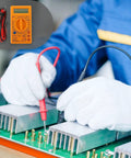 Gloved hands using Digital Multimeter With Buzzer Three And A Half Digit LCD Display Voltage Current And Resistance Tester