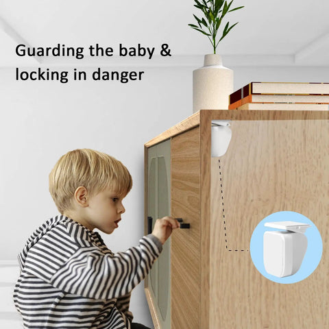 Child trying to open cabinet with Hidden Magnetic Cabinet Locks Set With Ten Locks And Two Keys For Baby Proofing.