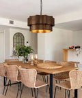 XSDeTu Farmhouse Metal Pendant Light, 2‑Tier Chandeliers for Dining Room hung over a modern dining table with chairs.