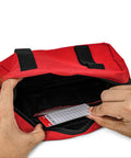 Person opening a red Lockout Tagout Kit Bag For Loto Devices, Heavy Duty Polyester Organizer with visible display for storage.
