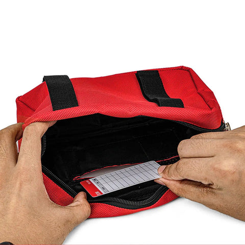 Person opening a red Lockout Tagout Kit Bag For Loto Devices, Heavy Duty Polyester Organizer with visible display for storage.