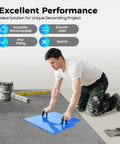 Person using 4 Pack 24x24 Inch Concrete Stamps Texturing Mats With Sturdy Handles for DIY patio pavers on concrete surface