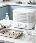 Sleek Digital Food Dehydrator With Adjustable Temperature And Timer For Fruits Veggies Meat Heavy Duty Electric Dryer setup on kitchen counter.