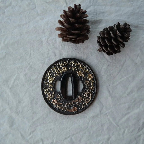 Koshirae Style Samurai Sword With Alloy Tsuba 100 Black And Gold Morning Glory Pattern close-up on tsuba with pinecones