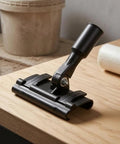 Sturdy Floor Coating Roller Clamp Accessory With Metal Handle Grip Holder Attachment For Tight Control And Stable Base, Ideal For Workshop Use, close-up on wood