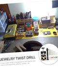 Workbench setup featuring the Hand Drill Jewelry Punch Tool Kit For Woodworking with assorted drill bits and tools.