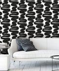 Mid-century modern room with Removable Peel And Stick Black And White Wiggle Room Wallpaper For Easy Mess Free Self Adhesive Wall Covering No Residue Left Behind DIY Friendly Mid Century Modern Vibe Made In The USA 20.5-Inch By 16.5-Foot behind a white sofa.