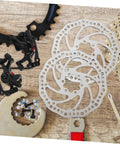 Heavy Duty Disc Brake Rotor Kit For Mountain Bike With Front Rear Pads Set 160mm Mechanical Caliper Forged Aluminum Build Killer Stopping Power Gnar Friendly Silver, tools and components displayed on wood.