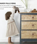 Child reaching for dresser with Retro Style Ring Cabinet Pulls And Drawer Handles In Solid Brass 4cm Antique Bronze Finish Dope