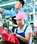 Hella Breathable Anti Static Mesh Work Cap Pink Dustproof Protective Hat Straight Up Ideal For Electronics And Cleanrooms Top Shelf Industrial Safety Headgear worn by a woman at a sewing machine.