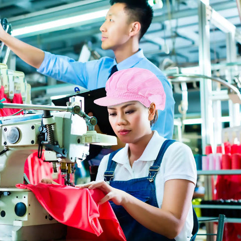 Hella Breathable Anti Static Mesh Work Cap Pink Dustproof Protective Hat Straight Up Ideal For Electronics And Cleanrooms Top Shelf Industrial Safety Headgear worn by a woman at a sewing machine.
