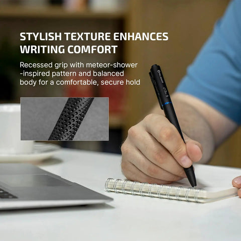 Person using O'Pen 3 EDC Pen Light Go-To 4 in 1 on notebook, showing textured grip and bolt action, next to laptop.