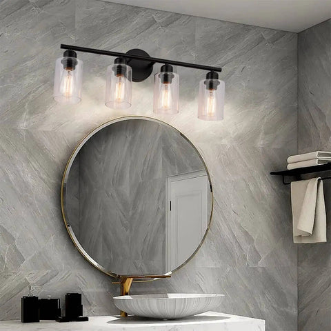 4-Light Modern Black Bathroom Vanity Light With Clear Glass Shades, Industrial Farmhouse Vintage Wall Sconce For Bathroom Dressing Table, 24 Inch Long Vanity Lighting Fixture in bathroom setting