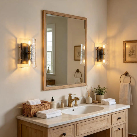 MWZ Modern 2-Light Wall Sconce Set of 2 with Water Rippled Glass Shades 11" illuminating a bathroom vanity with mirror.